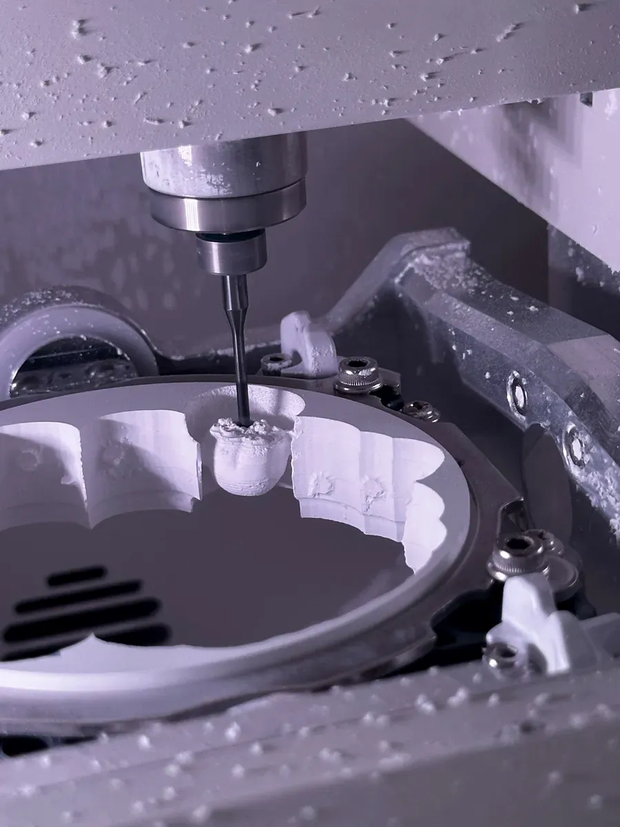 CNC machine cutting a precision component